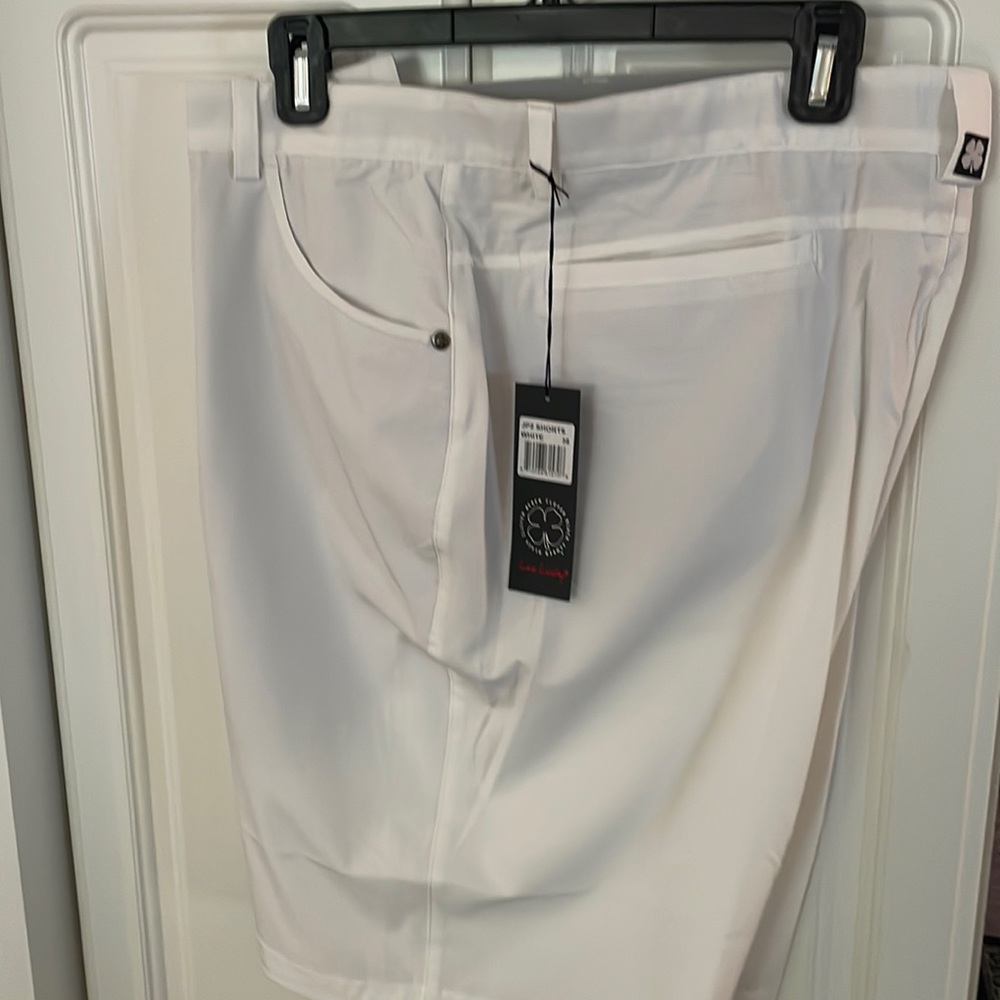 Men’s Black Clover white golf shorts. 38 inch waist. New with tag.
